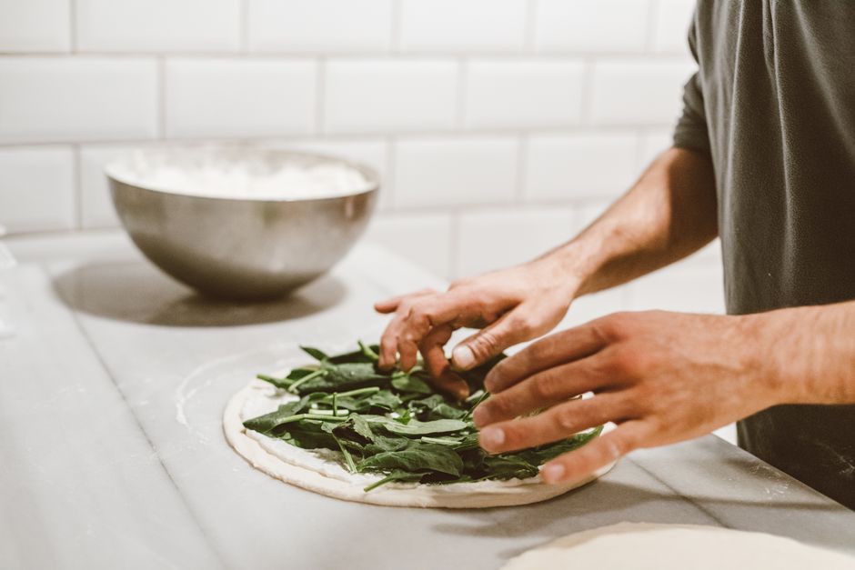Pizza chef preparing dough with professional technique